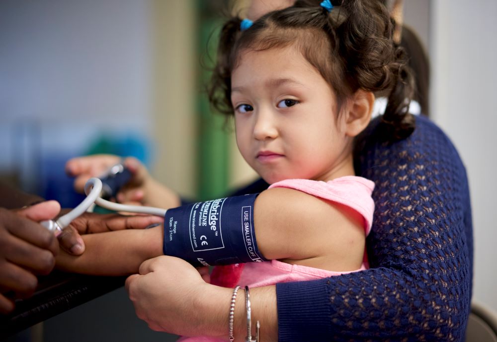 Young girl having her blood pressure taken.