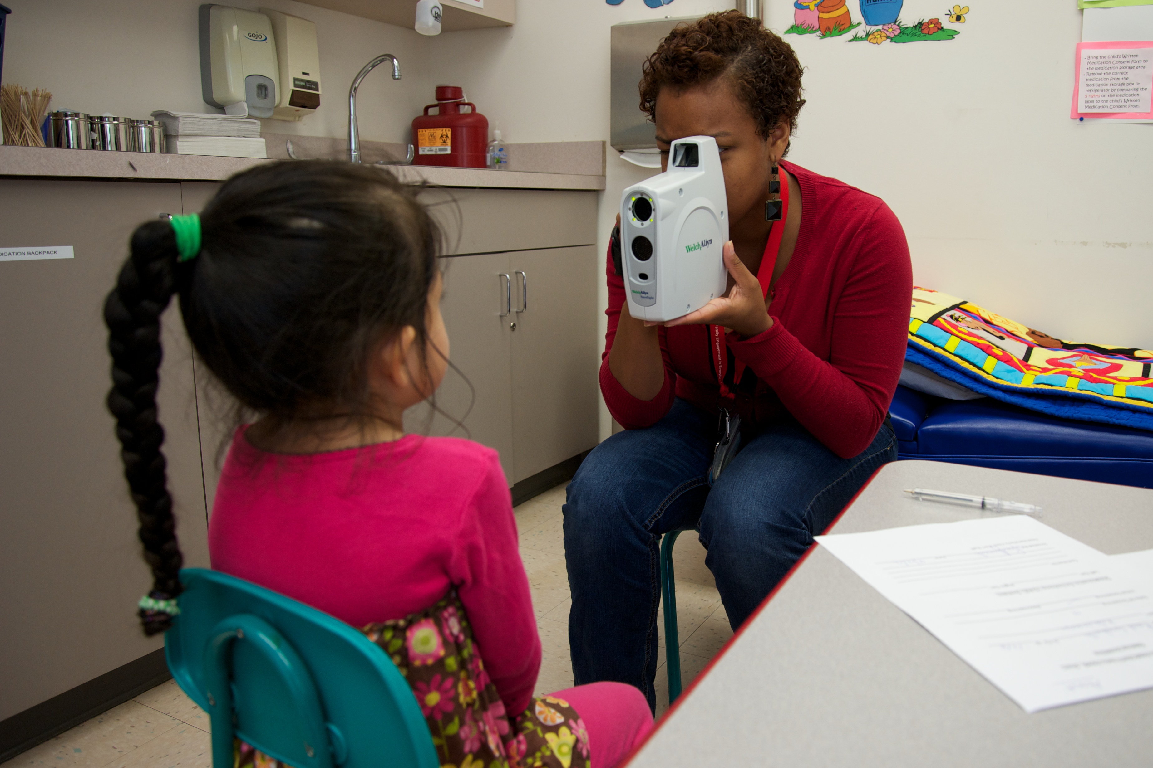 Child going through a vision screening.