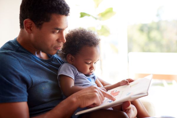 Father reading to child.