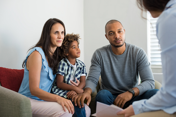 Parents with child at a dental consult.