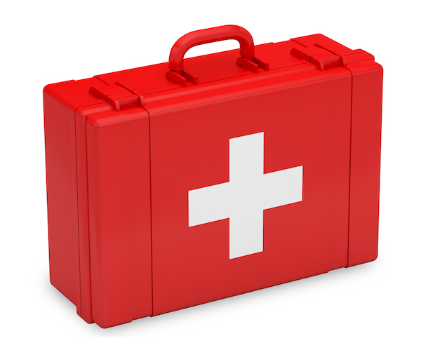 A red first aid case with a large white cross on the side and a carry handle on top.