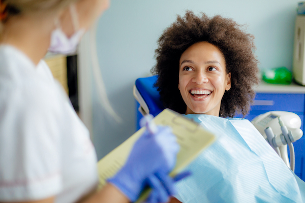 Smiling woman visiting the dentist.