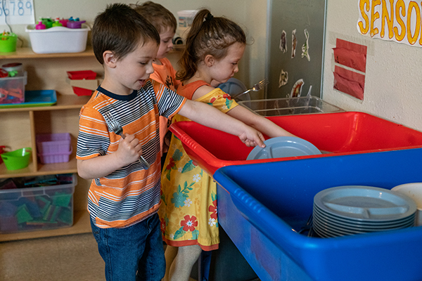 Children washing toys.