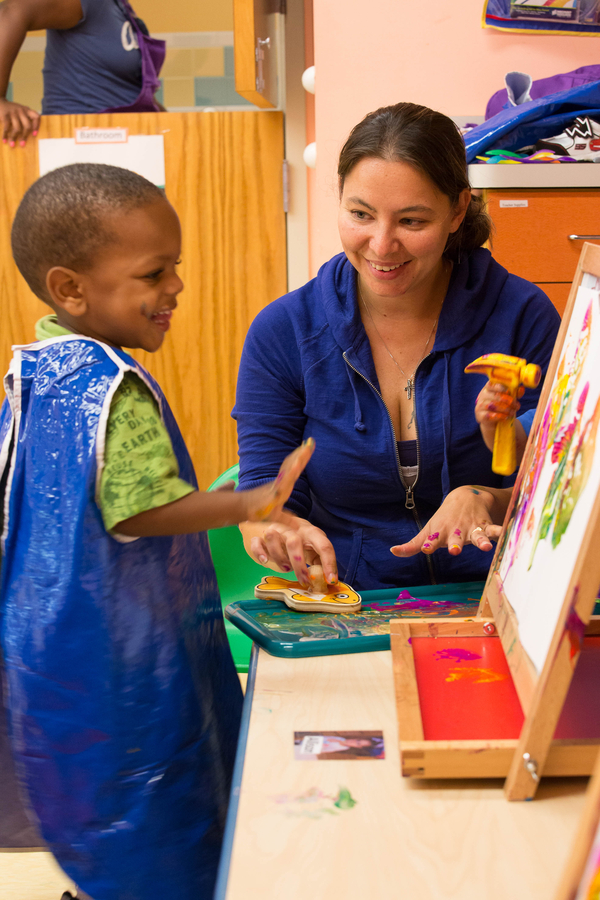 Teacher and child interacting.