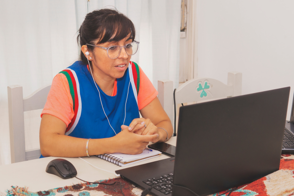 Woman with glasses studying with her laptop.