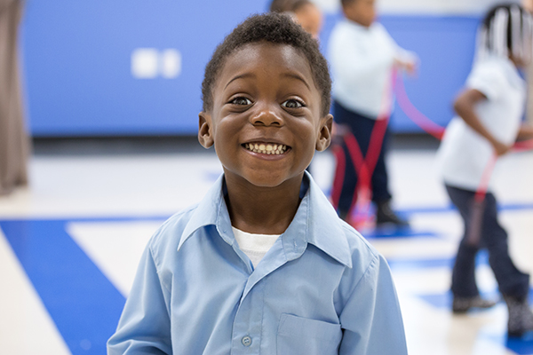 African American young boy smiling.