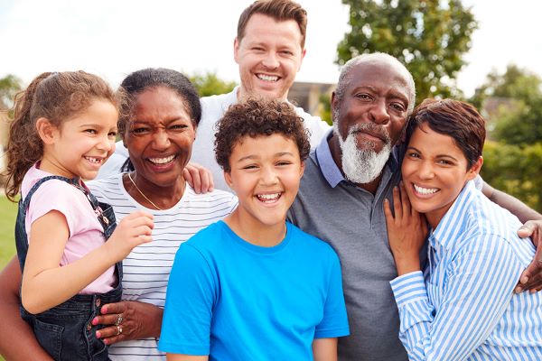 Family standing together for a portrait.