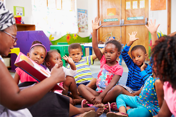 Teacher sharing a book at circle time.