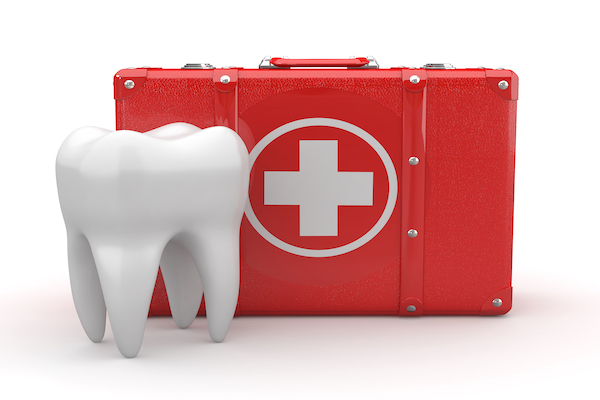 Graphic of a tooth next to a first aid kit.