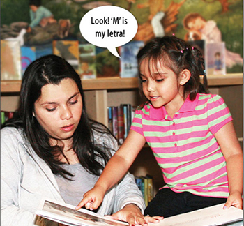 woman and girl looking at book