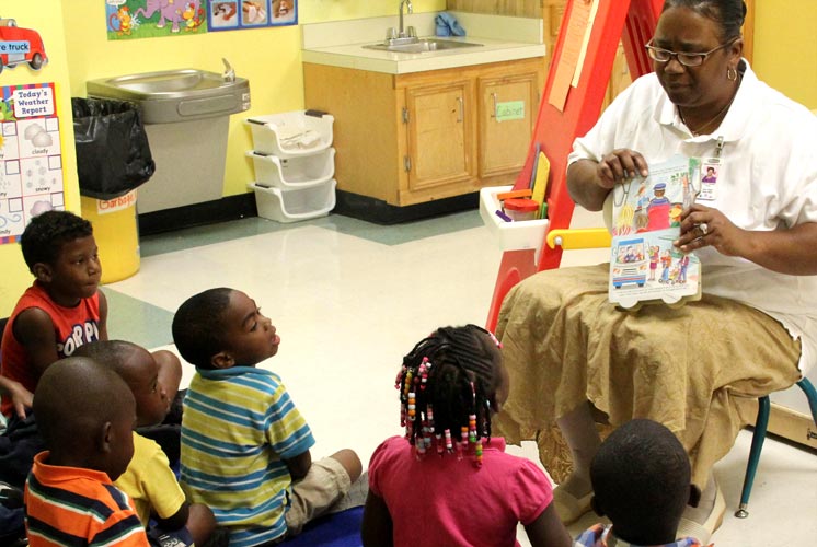 woman reading to child