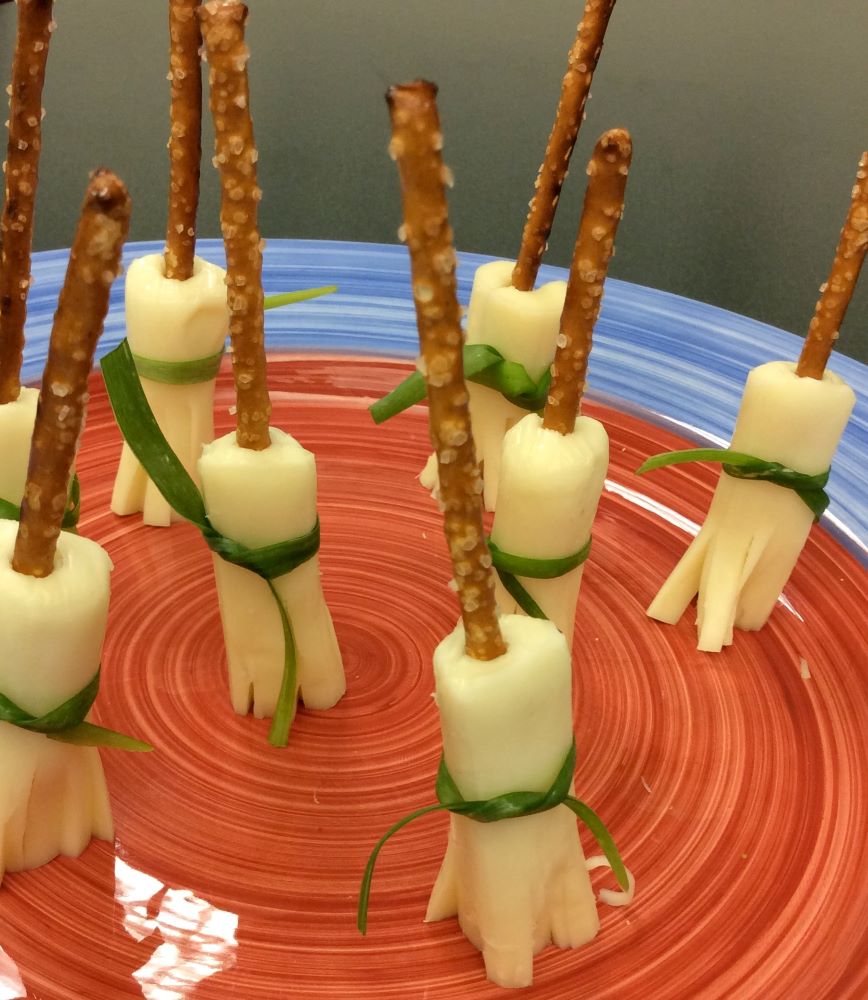 Pretzel and cheese broomsticks.