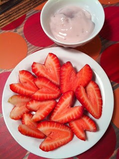 Strawberry hearts and yogurt dip.