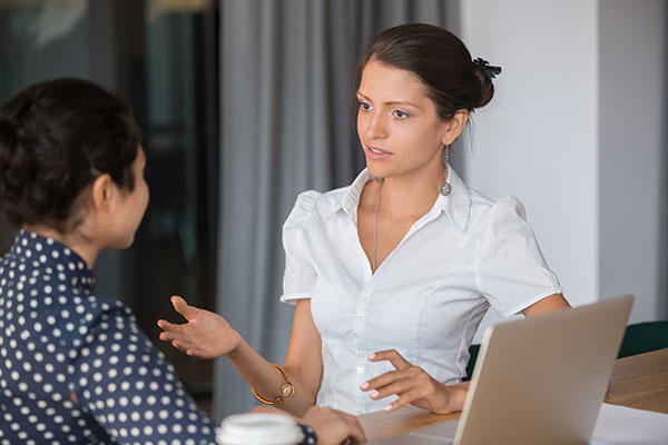 Diverse female workers working with a computer