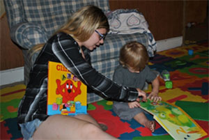 Mother reading books with child