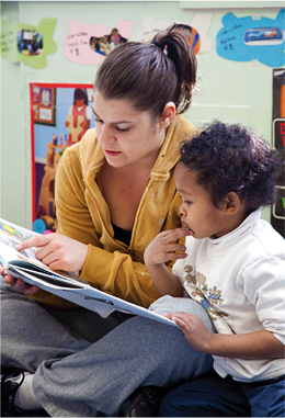 Woman reading with child