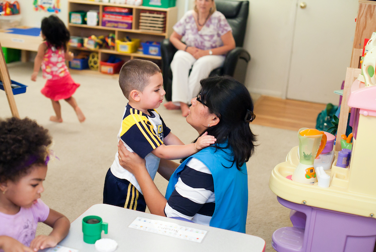 Instructor holding kid