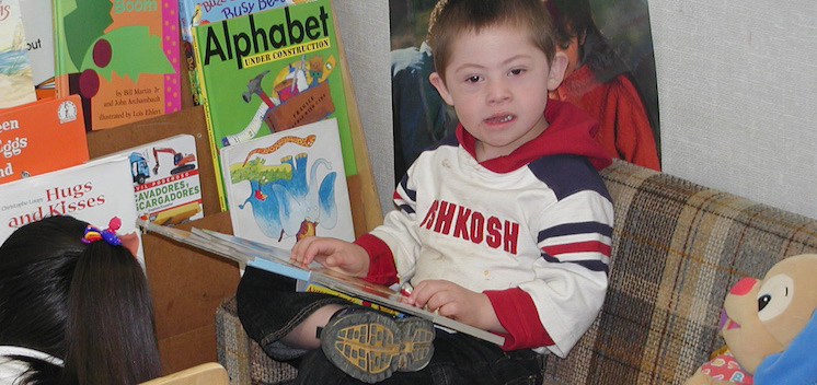 Little boy holding a book