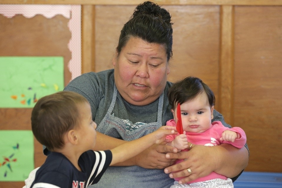 woman taking care of two children