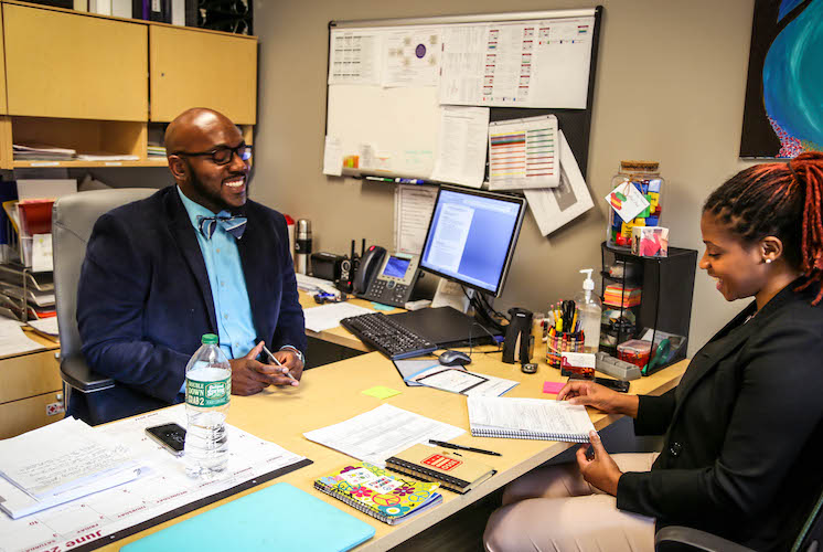 People in a meeting smiling