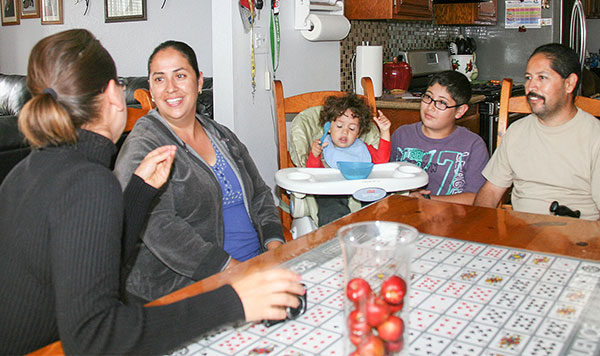 Family talking with a home visitor