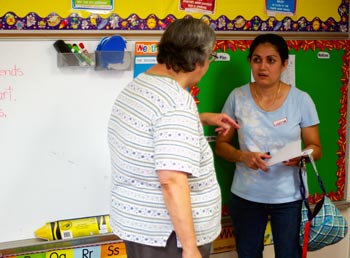 teachers talking in classroom