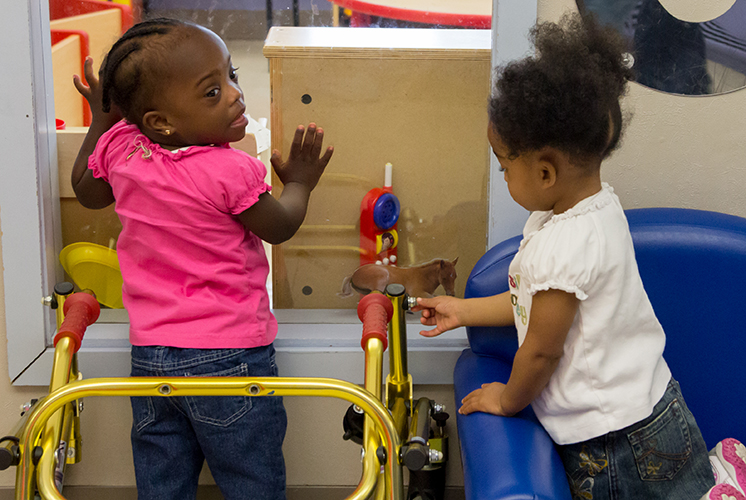 two girls playing indoors