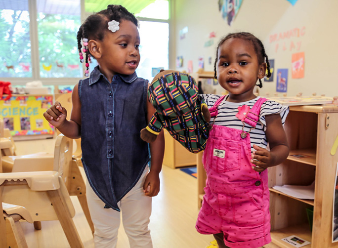 Two little girls talking