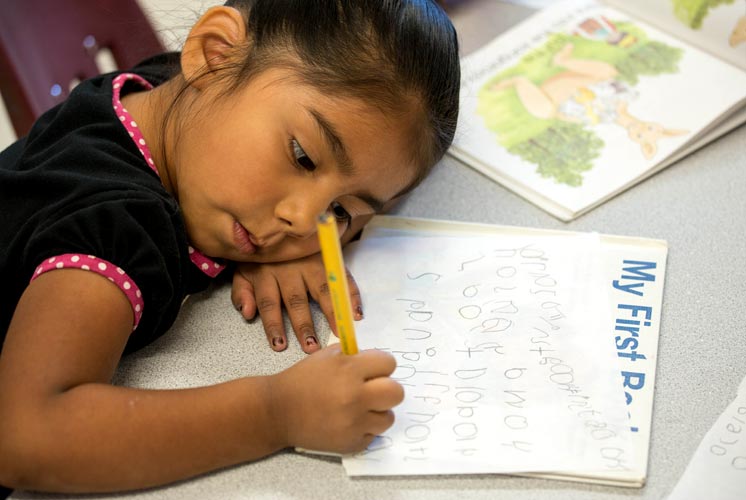 woman reading to child